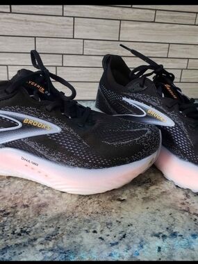 Brooks Women's Black Running Shoes with Subtle Pink Midsole and Gold Logo